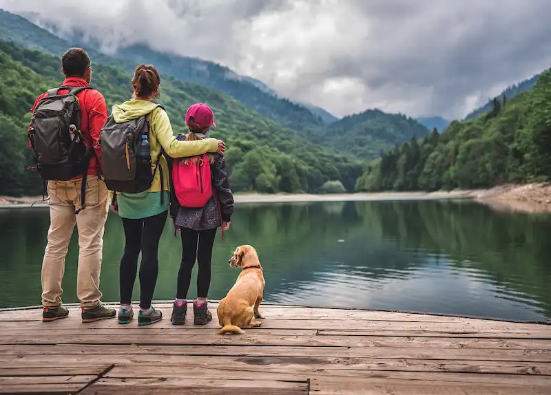 Happy family with children enjoying a mountain view
